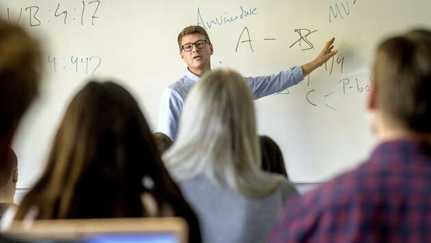 Teacher in classroom.